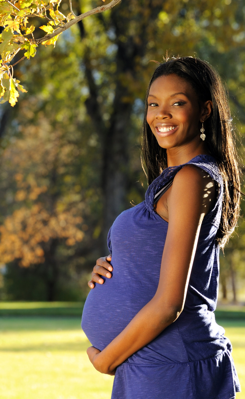 Pregnant woman looking at the camera